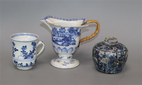 An Annamese blue and white jarlet, a Kangxi blue and white cup and a Qianlong blue and white helmet jug tallest 12cm